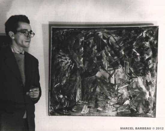 Marcel Barbeau with his painting “Fougue intermède gracile-toc“ ((1946)at the secon automatist exhibtion at the Gauvreau's, February 15 1947. Photo Fonds Maurice Perron du Musée national des Beaux-arts du Québec, kindly authorirized by Line-Sylvie Perron. Copyright © Carmen Perron.