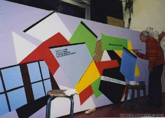 Marcel Barbeau completing his painting "Invitation au voyage" (1998). hoto Ninon Cauthier. © Ninon Cauthier (photo); © ADAGP-Paris pour Marcel Barbeau (peinture),