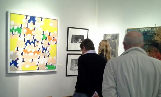 Élysées Art Fait visitors at Galerie Chauvy stand looking atsome Marcel Barbeau's art works. Author : Galerie Chauvy.