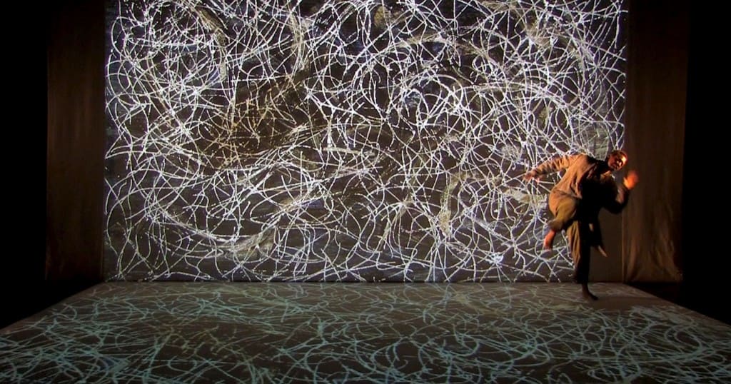 A scene of the live performance Century Song with Marcel Barbeau work , Rosier-feuilles, serving as the backdrop to a dance by the show's star - soprano Neema Bickersteth. Summer 2014.
